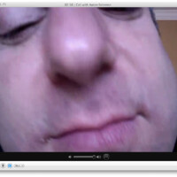 My brother Aaron is imitating the way my Dad looks for something on his desktop. Dad gets his nose shoved up real close to the screen, right up to the camera. In this shot Aar may have left some hummus on the corner of his mouth for dramatic effect.